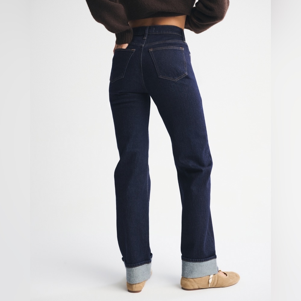 High Rise Dark Blue Jeans. Rinse color cuff hem